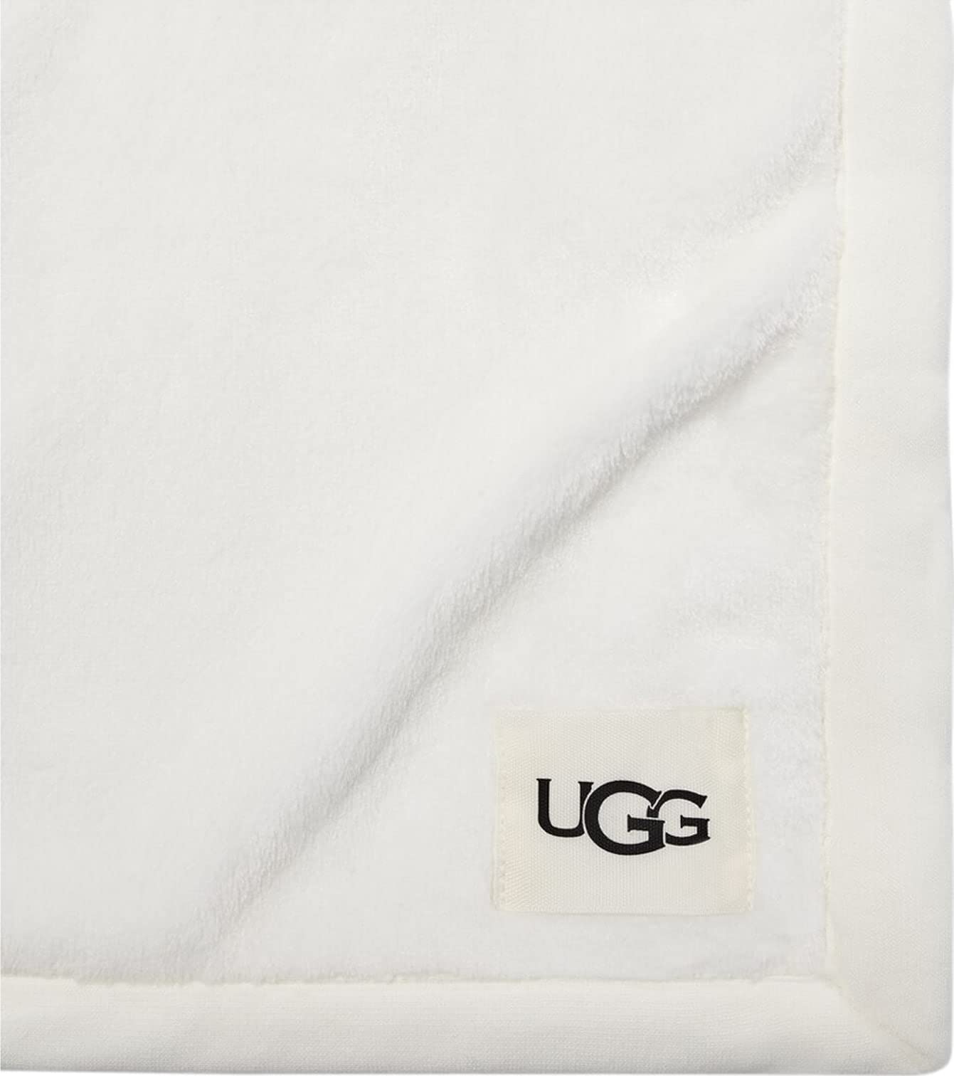 UGG Duffield Throw close-up of trim and woven label highlighting soft finish