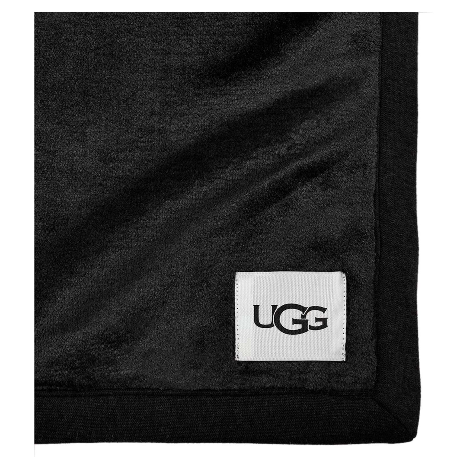 UGG Duffield Throw styled on sofa creating inviting warmth and room polish