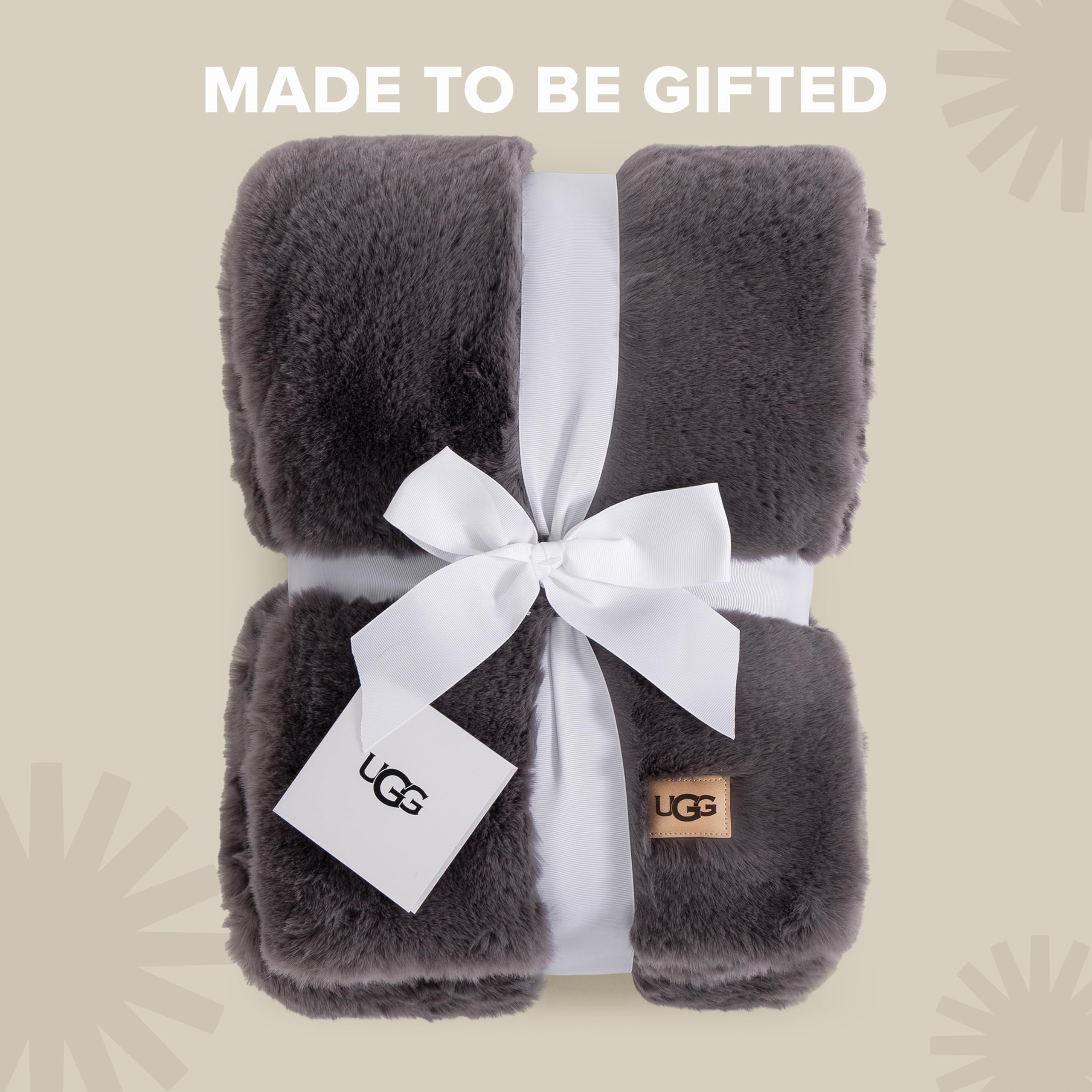 UGG euphoria draped over bed footboard creating layered bedroom appeal