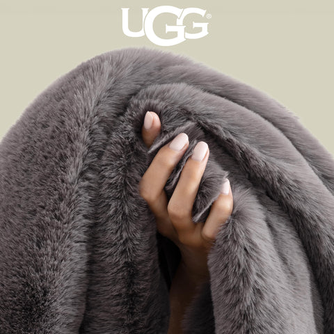 UGG euphoria folded on sofa adding warmth and polished home styling