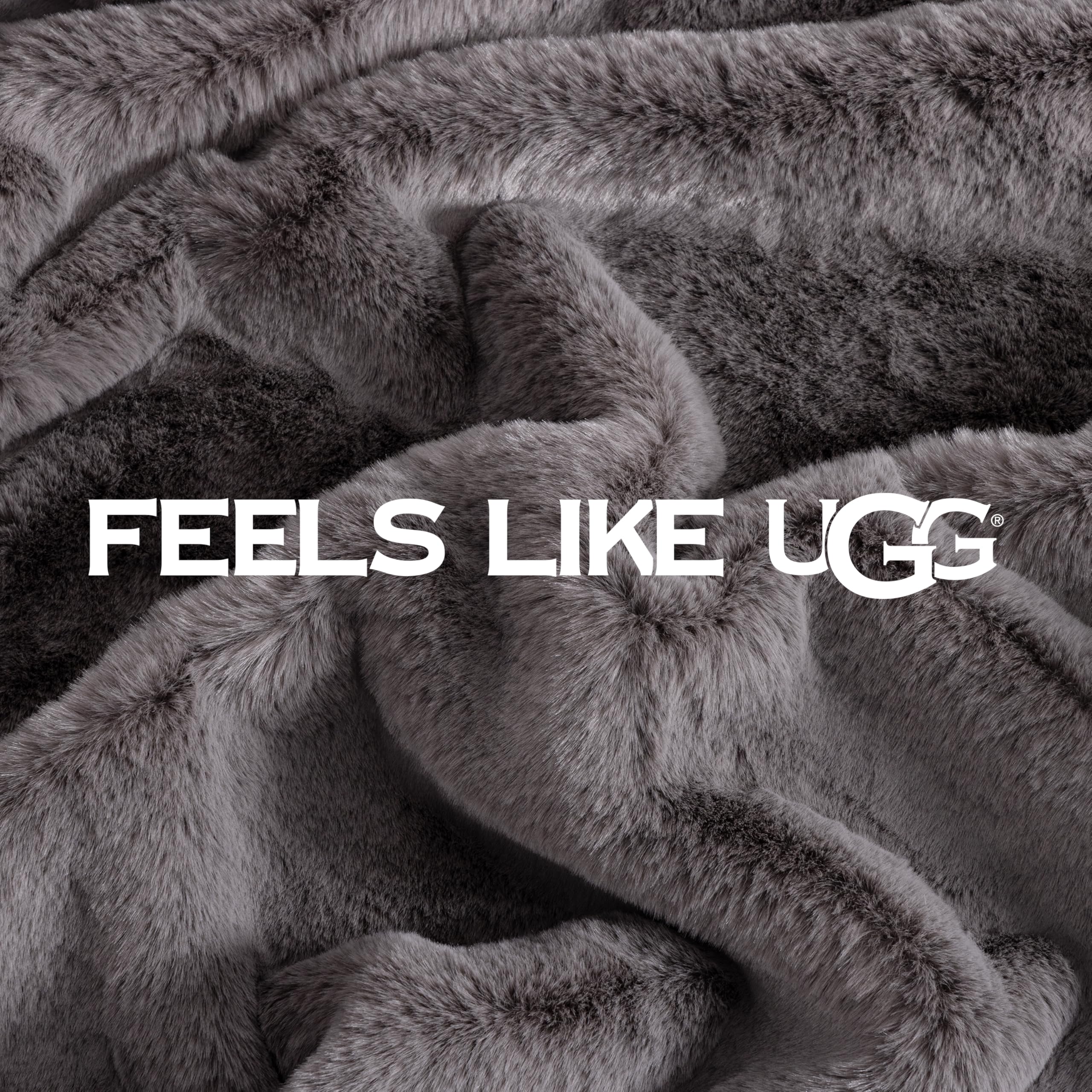 UGG euphoria next to chair showing 50 by 70 inch size and scale