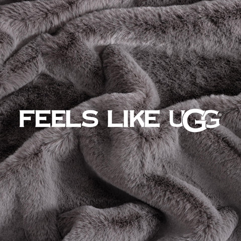 UGG euphoria next to chair showing 50 by 70 inch size and scale