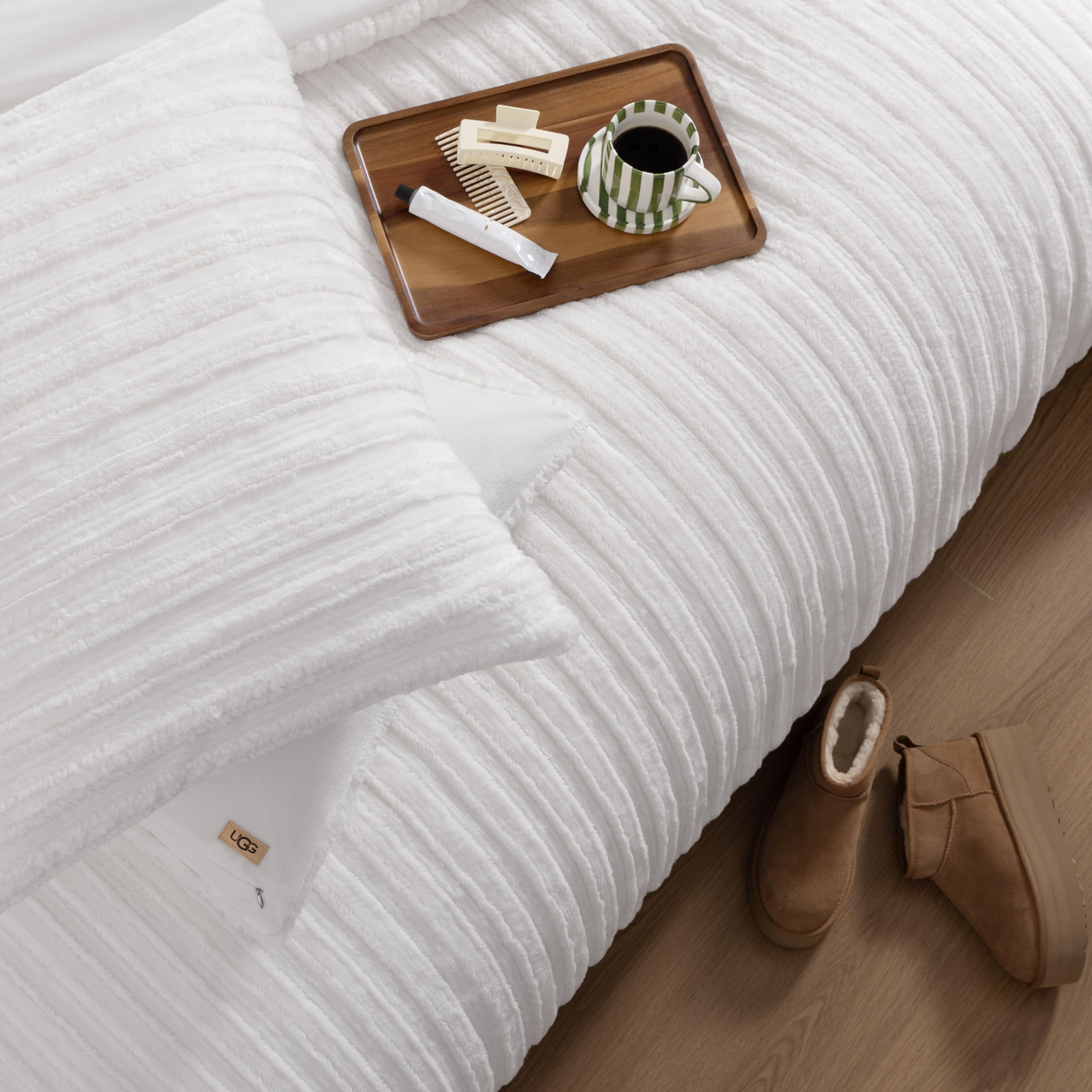 UGG Kenzie on queen bed demonstrating generous drape and proper size fit