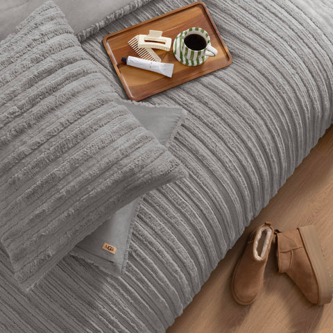 UGG Kenzie comforter beside ruler showing generous queen dimensions