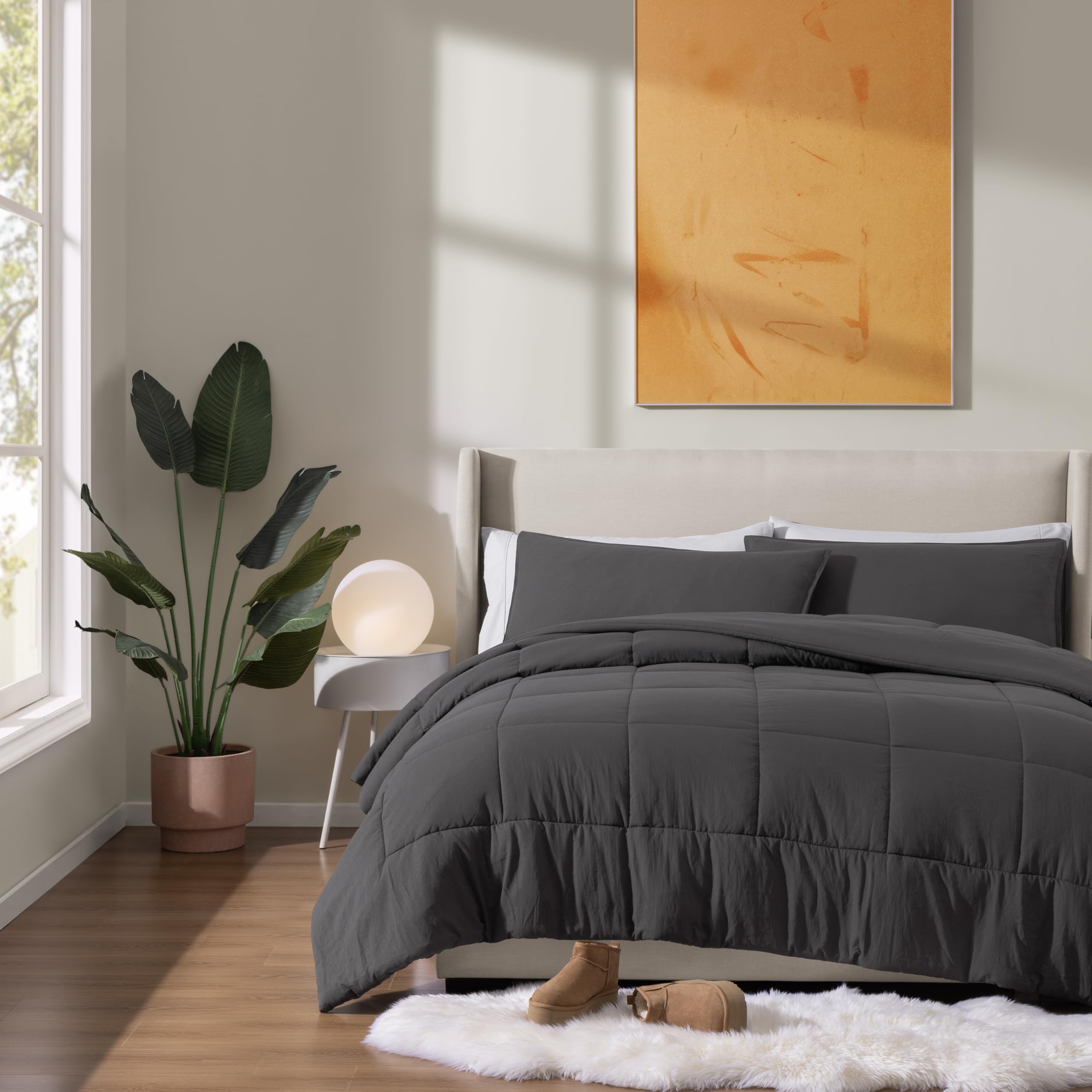 UGG Leonora comforter on bed lifestyle showing year-round comfort and elegant styling