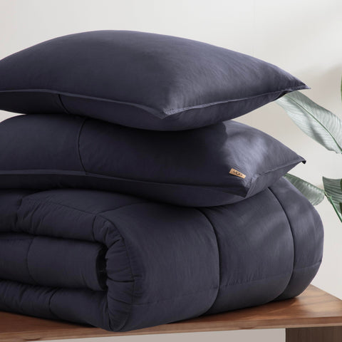 UGG folded comforter in packaging showing compact storage convenience