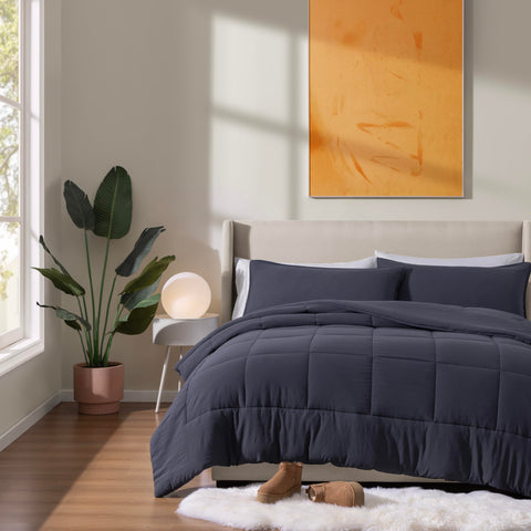 UGG comforter draped on king bed showing generous size and fit