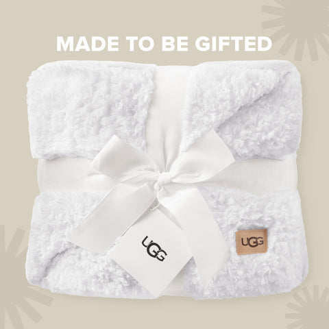 UGG Nita styled on a sofa adding warmth and modern decor