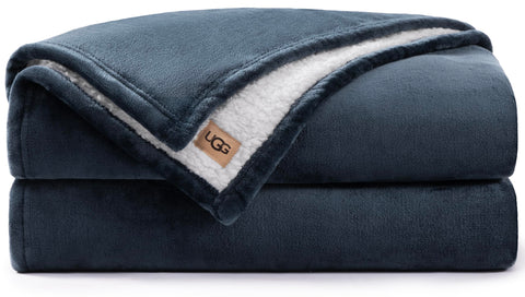 UGG Nita blanket front flat lay showing navy color and full coverage benefit
