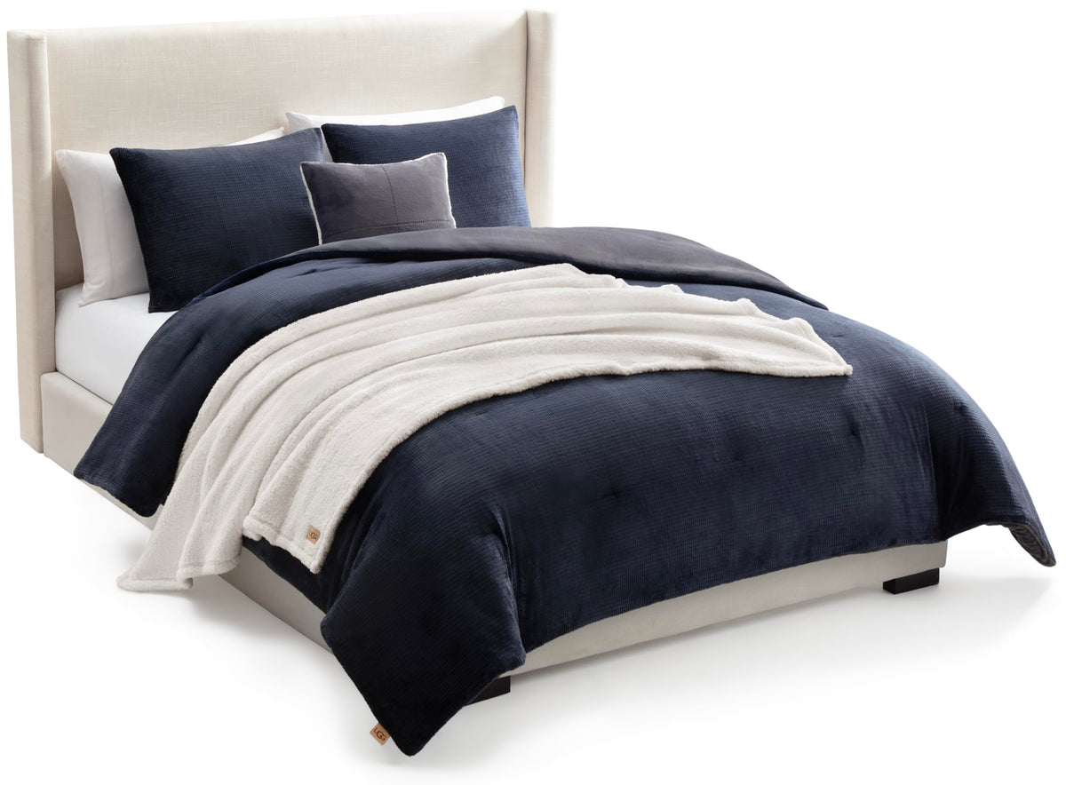 UGG Remina front view showing navy comforter set and clean styling benefit