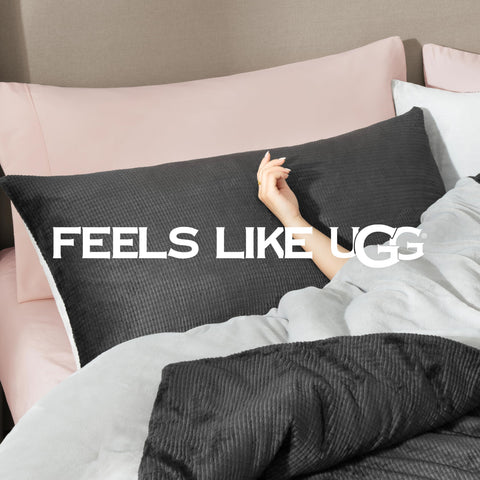 UGG remina on king bed for scale, demonstrates full coverage and drape