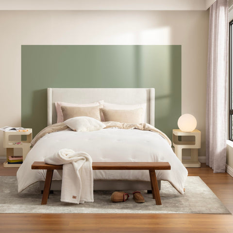 UGG throw blanket spread on bed showing extra layer and cozy convenience