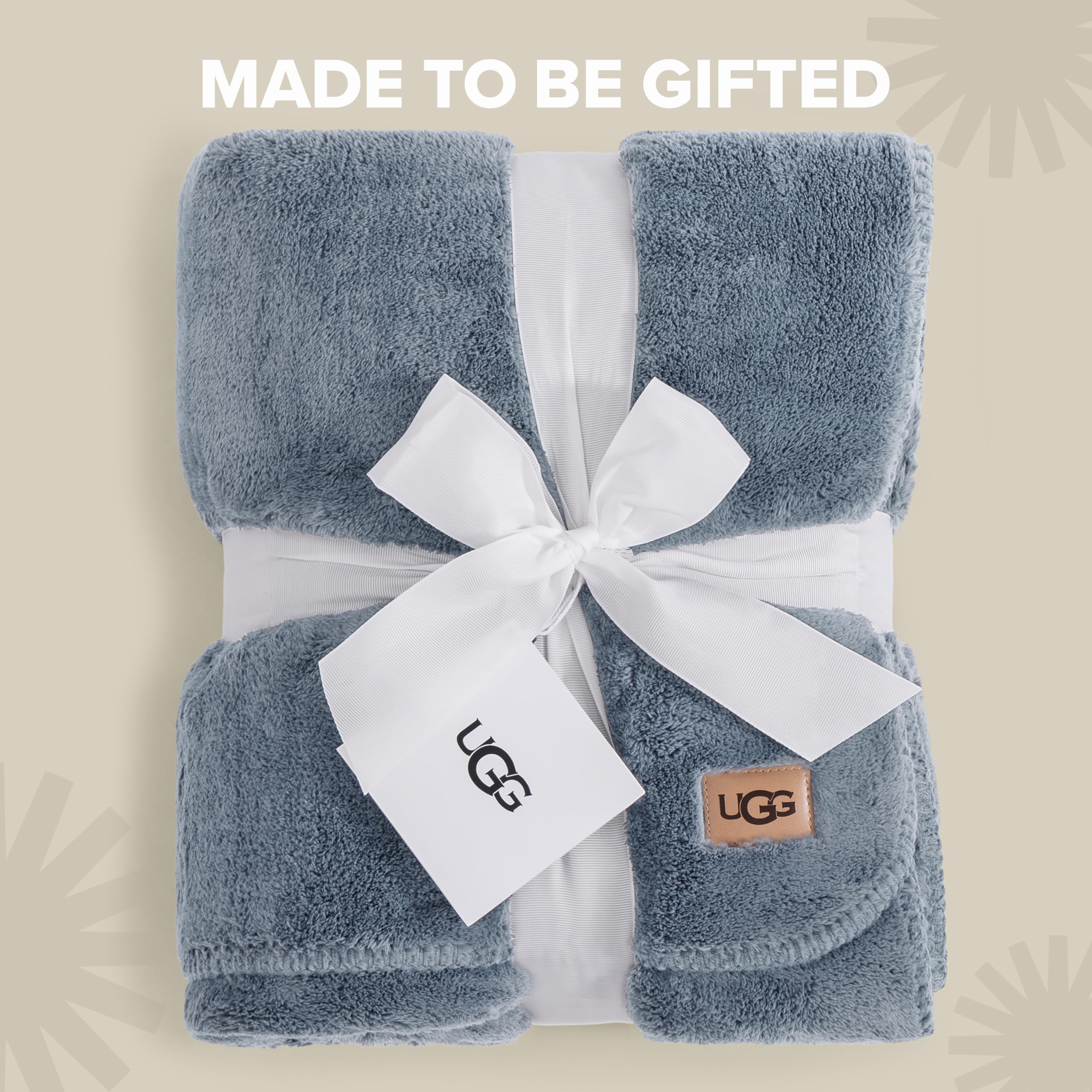 UGG Whitecap draped over sofa showing visual warmth and decorative layering