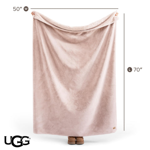 UGG whitecap draped over sofa adding warmth and visual interest