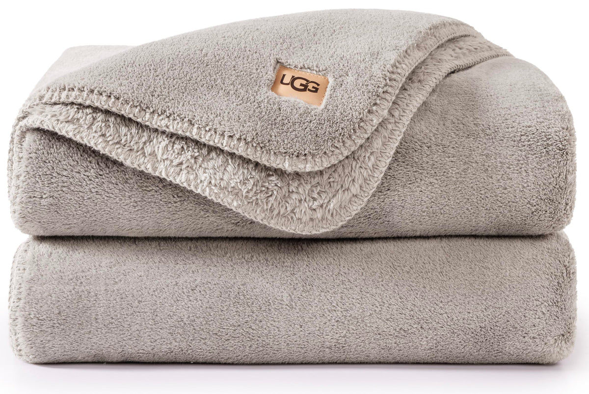 UGG Whitecap front view on couch showing soft neutral style and cozy appeal