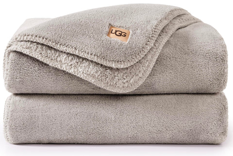 UGG Whitecap front view on couch showing soft neutral style and cozy appeal