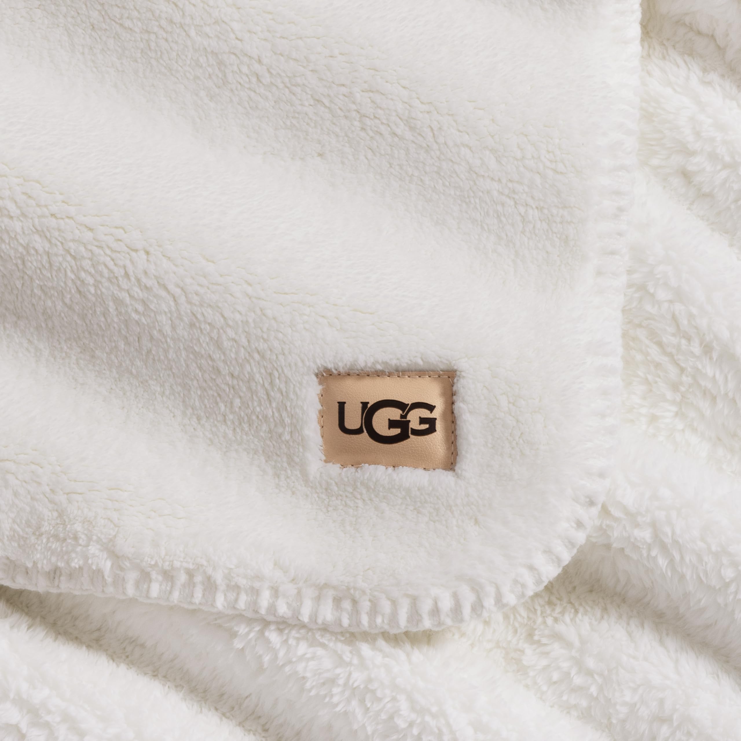 UGG whitecap in hands demonstrating plush feel and easy handling