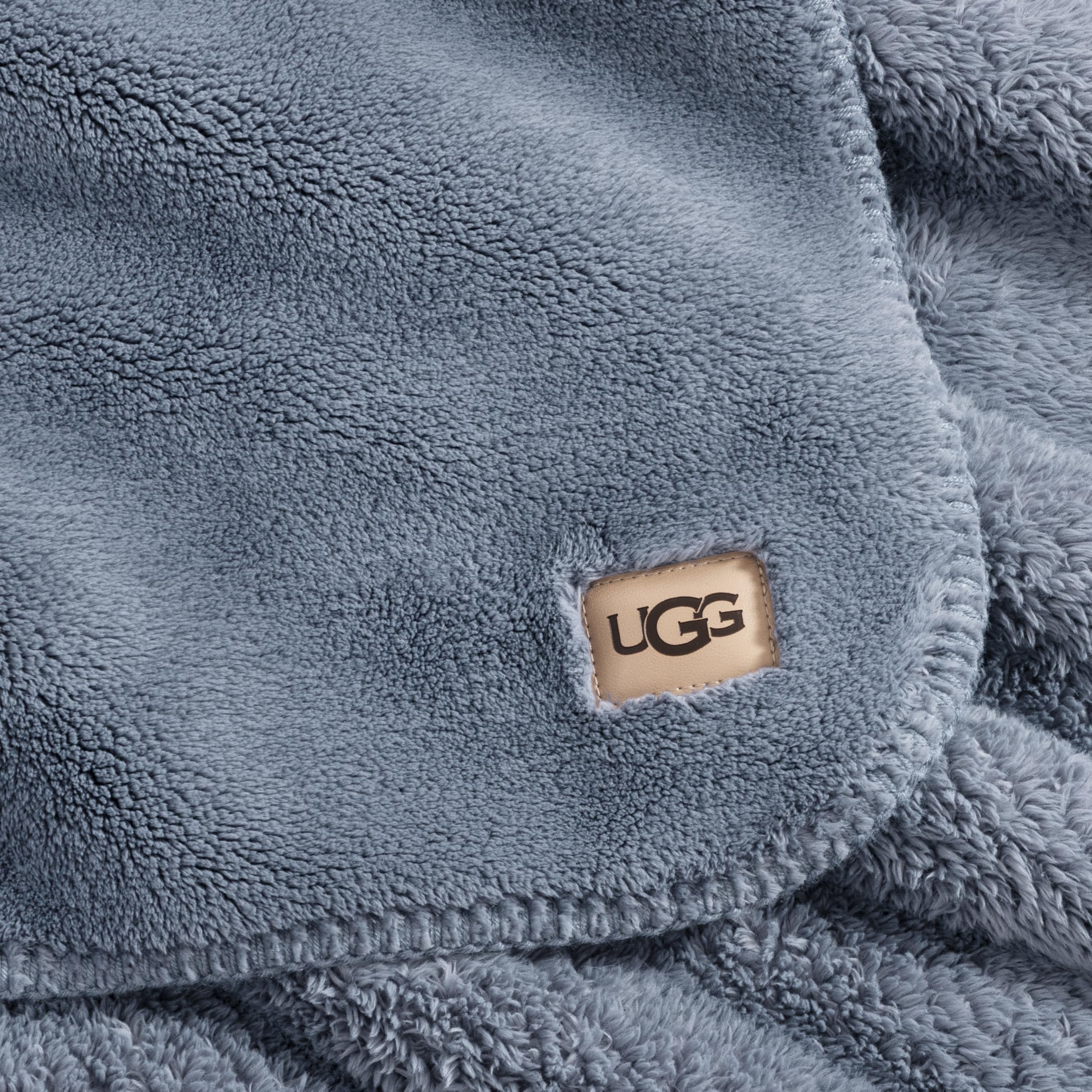 UGG Whitecap in use on couch with reader conveying relaxed comfort and usability