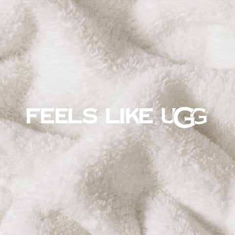 UGG whitecap next to pillow for scale and generous coverage benefit
