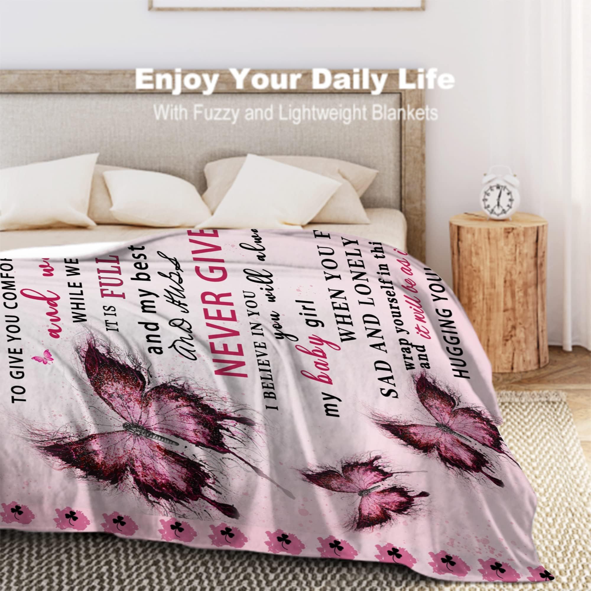 UHANKRU folded blanket next to a book illustrating compact storage convenience