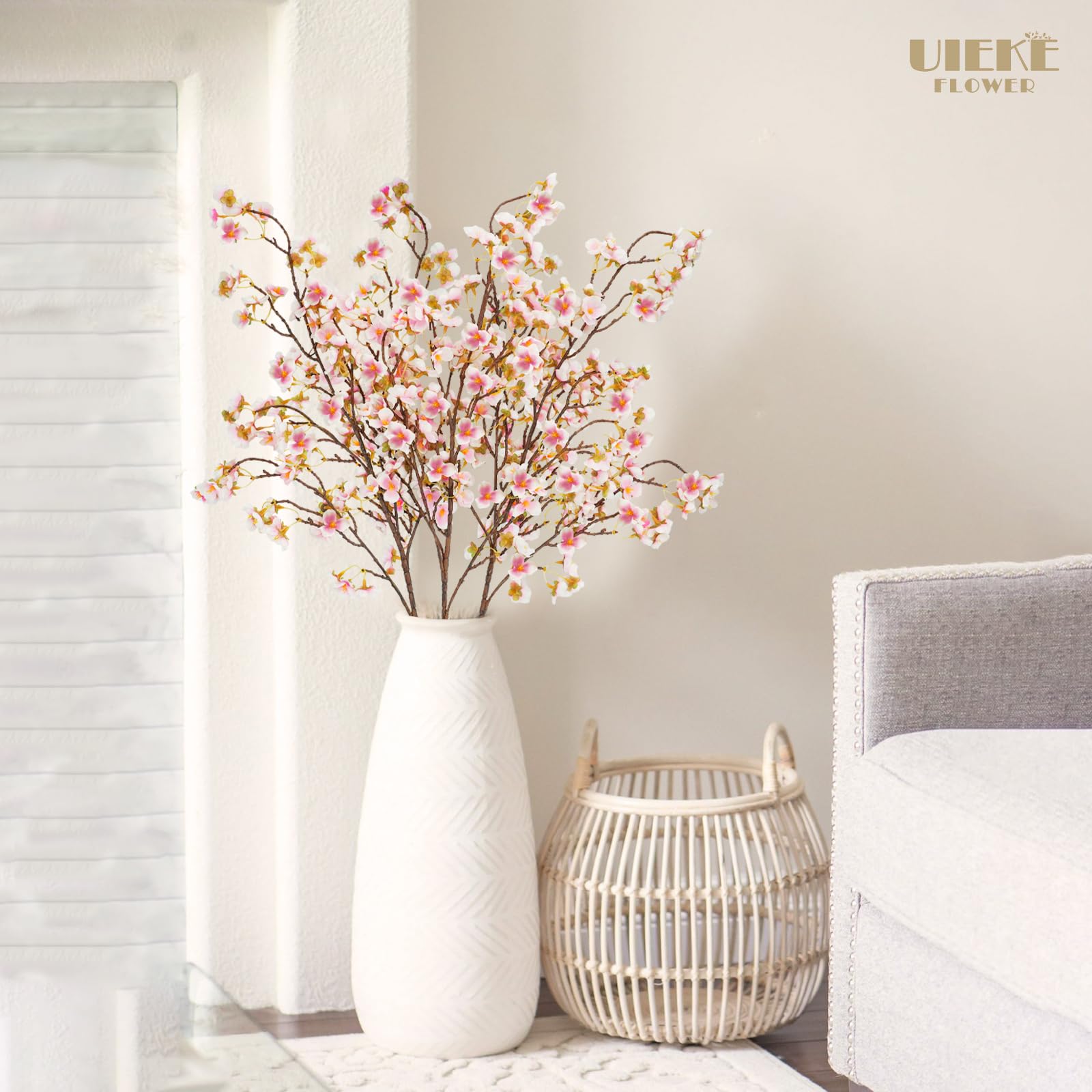 Uieke hands arranging stems in vase for easy setup and adjustment