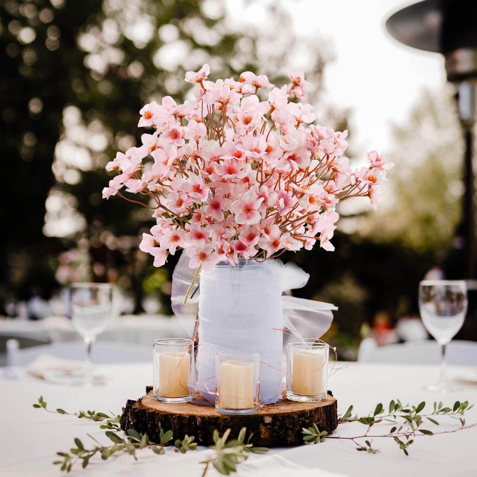 Uieke hanging cherry branches on a doorway creating instant seasonal atmosphere without upkeep