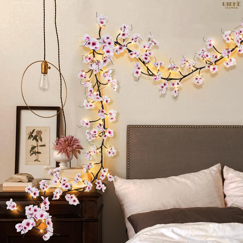 Uieke garland next to hands for scale, clarifying 6ft length and placement