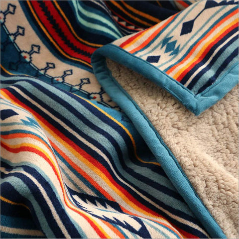 UKELER throw on bed styling showing layered décor and added warmth