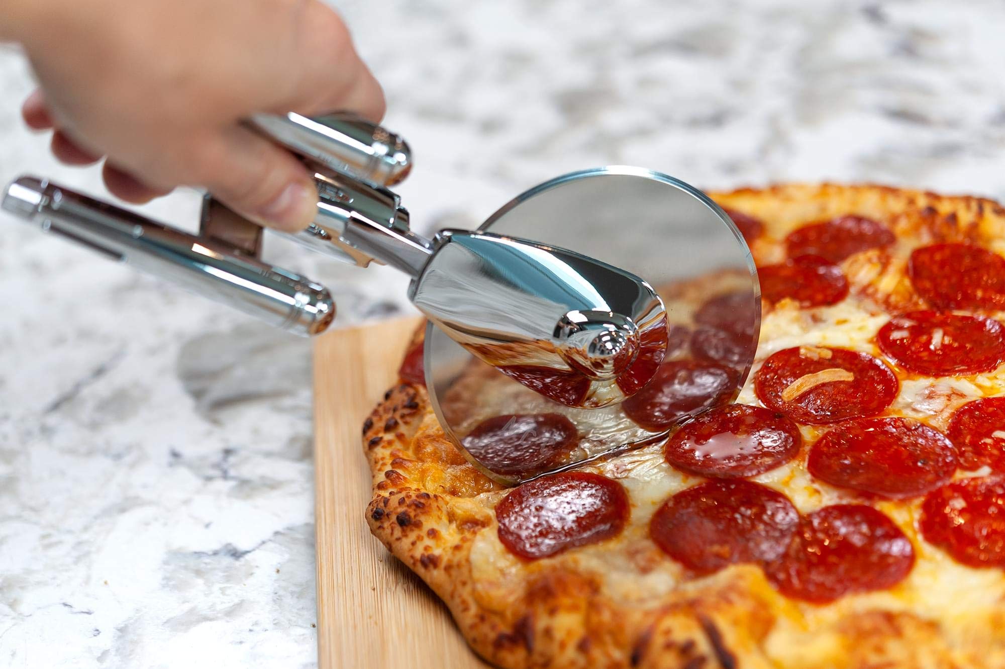 Ukonic pizza cutter in a modern kitchen demonstrating decorative and practical use