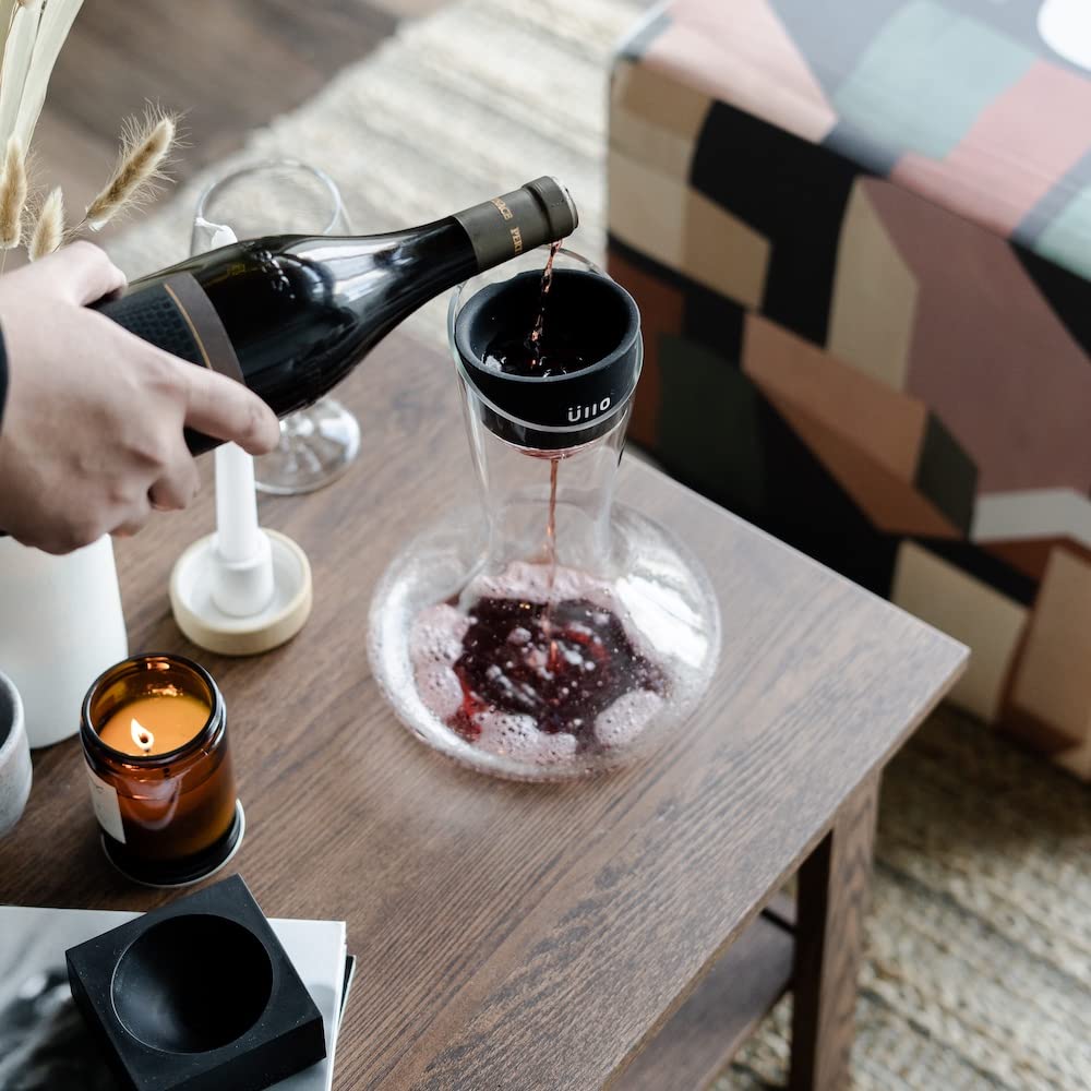 Üllo decanter beside wine bottle for scale showing household fit and size