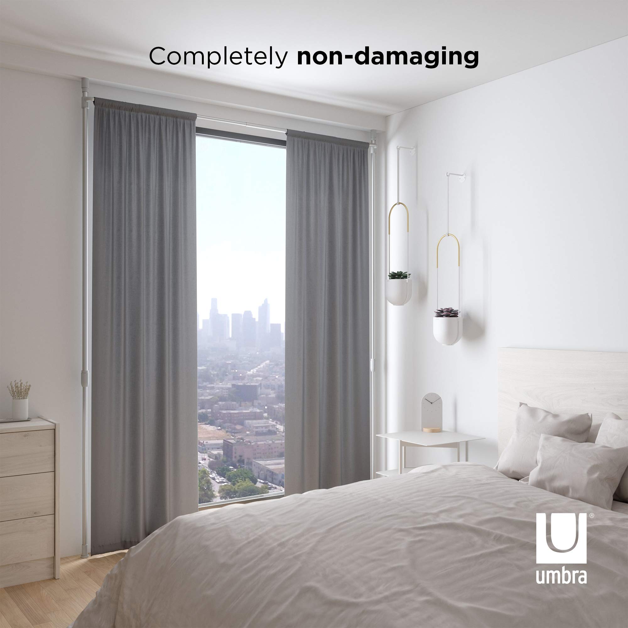 Umbra rod fully extended height showing tall-ceiling adaptability benefit