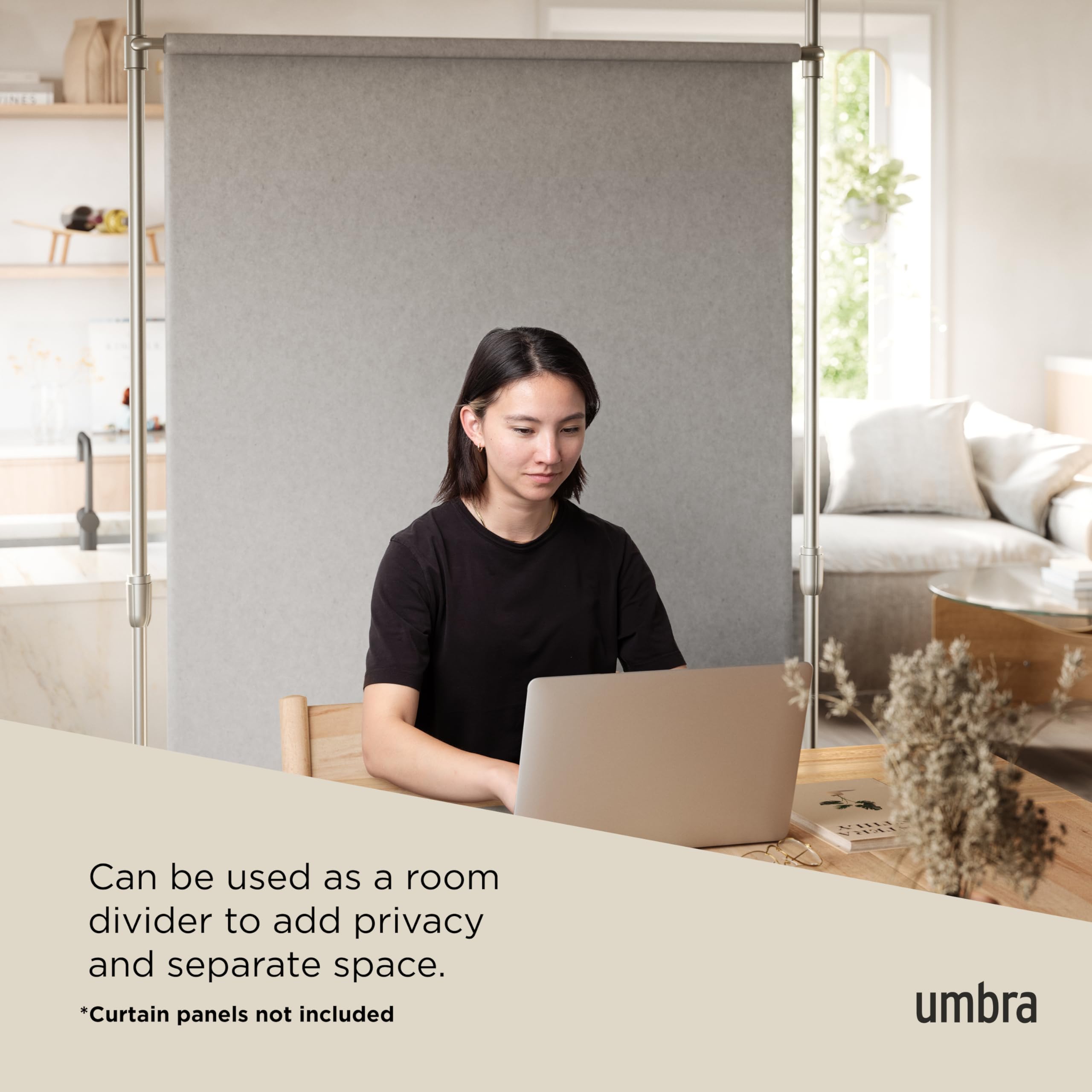 Umbra rod next to person showing adjustable 7–10 ft height