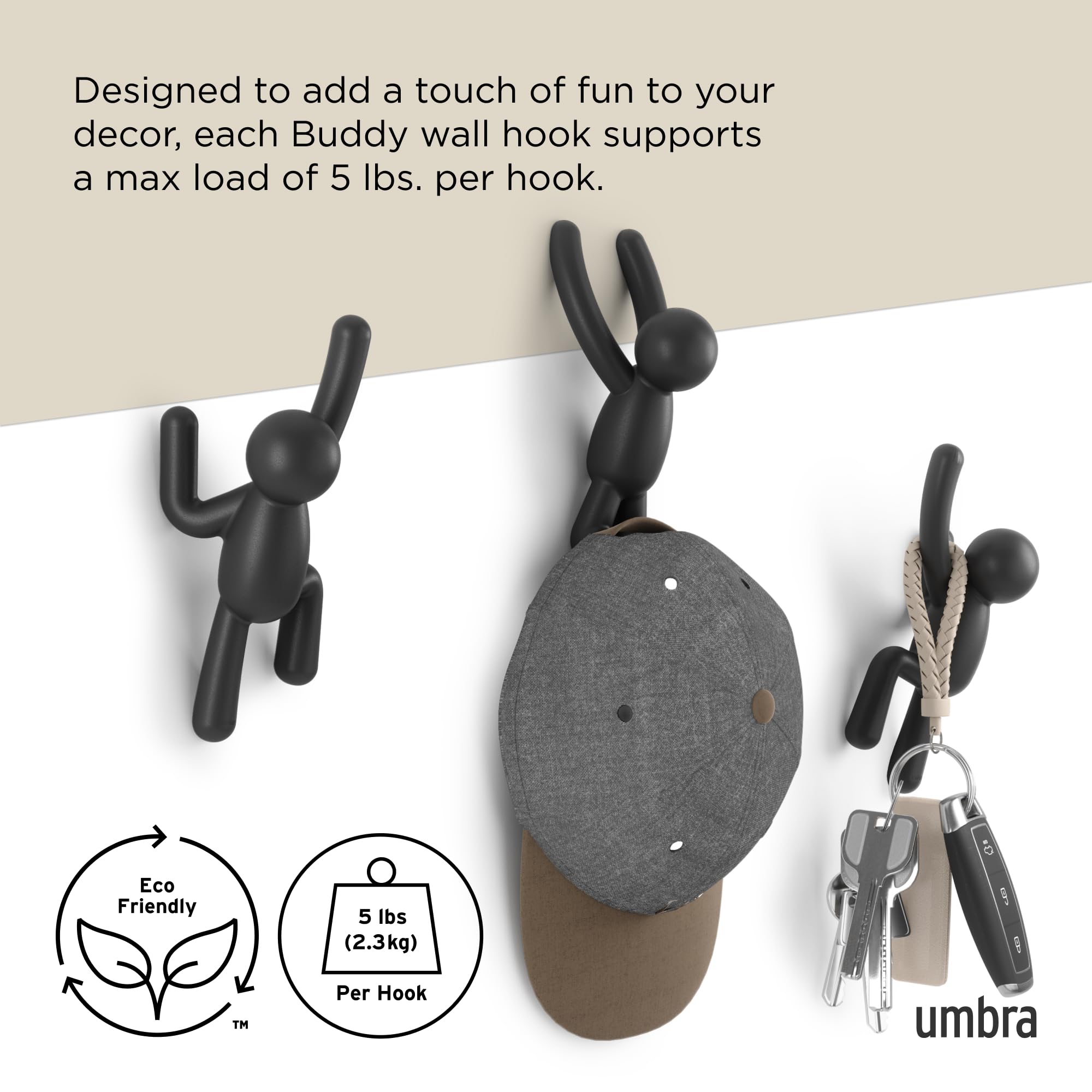 Umbra Buddy next to hand for scale showing compact size and practical benefit