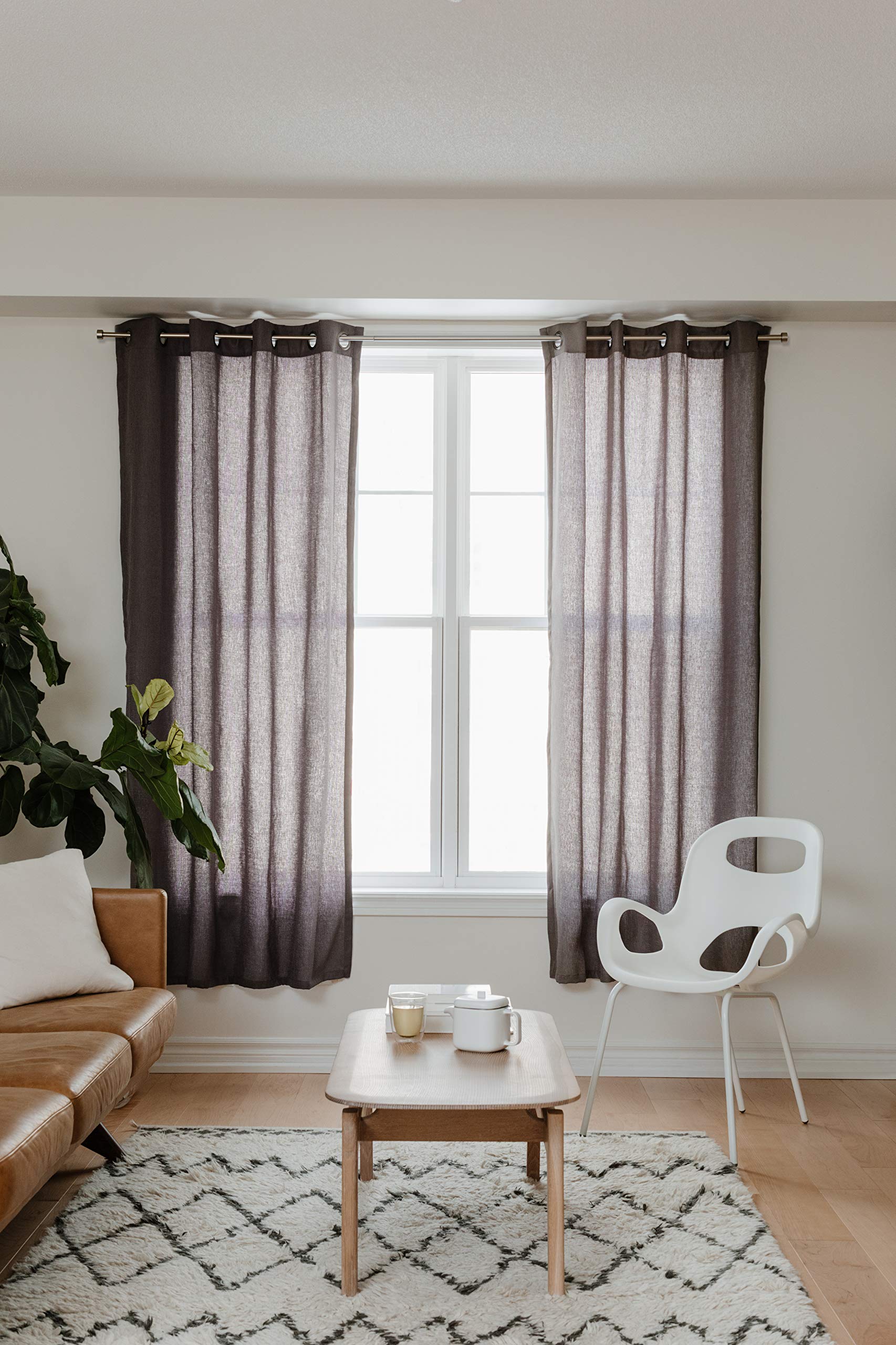 Umbra Cappa lifestyle living room scene showing stylish curtains and cohesive look