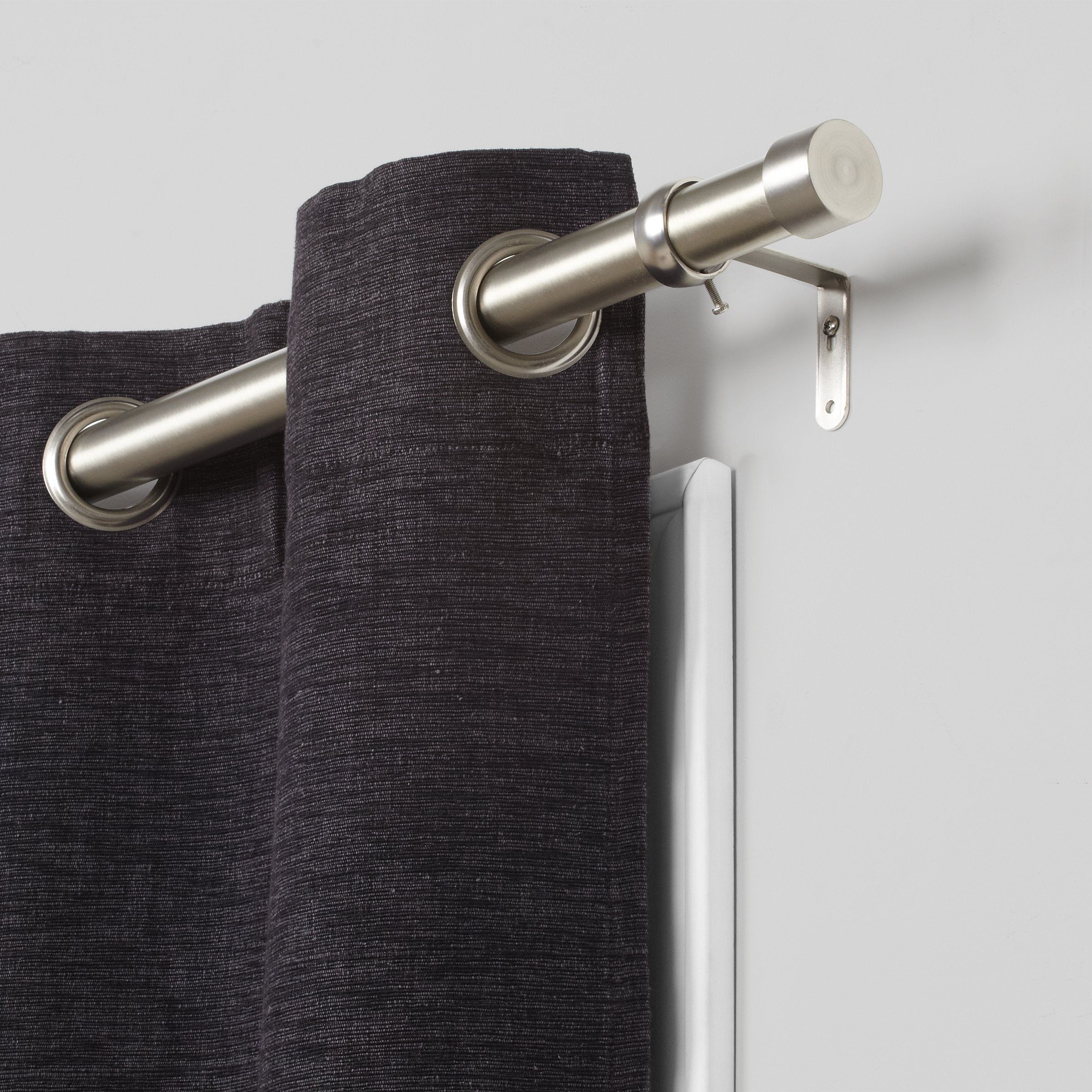 Umbra Cappa profile edge view displaying low-profile rod, blends unobtrusively