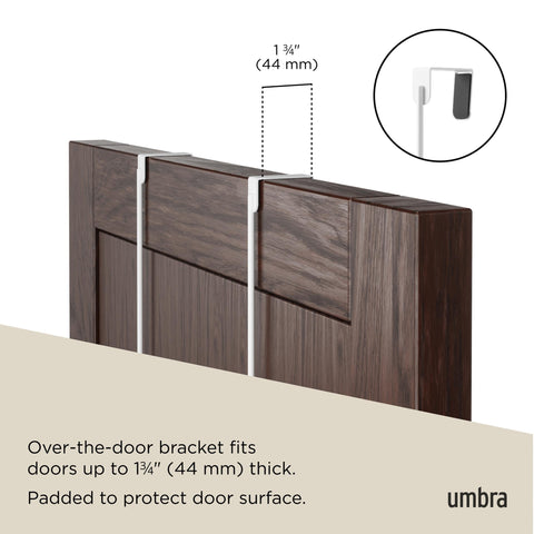 umbra Estique holding coats and bags demonstrating organized entryway benefit