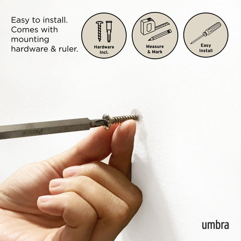 Umbra Flip holding coats and bags for organized, accessible storage