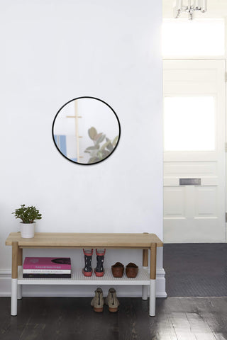 Umbra Hub reflecting natural light in a styled interior to enlarge visual space
