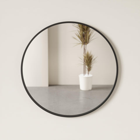 Umbra Hub above fireplace reflecting room for cohesive decor