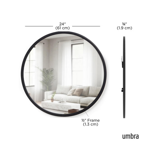Umbra Hub mounted in bathroom reflecting light and brightening the vanity area
