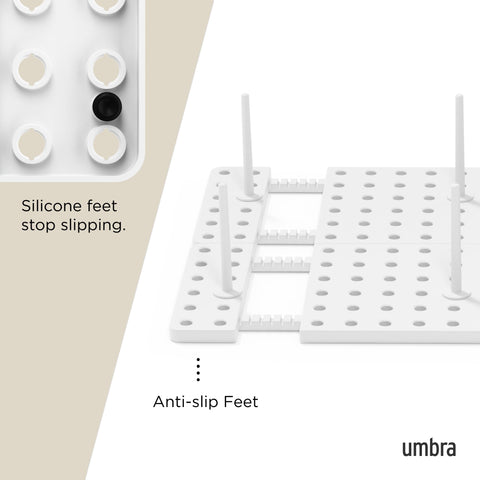 Umbra Peggy beside a ruler for scale showing adjustable extension benefit