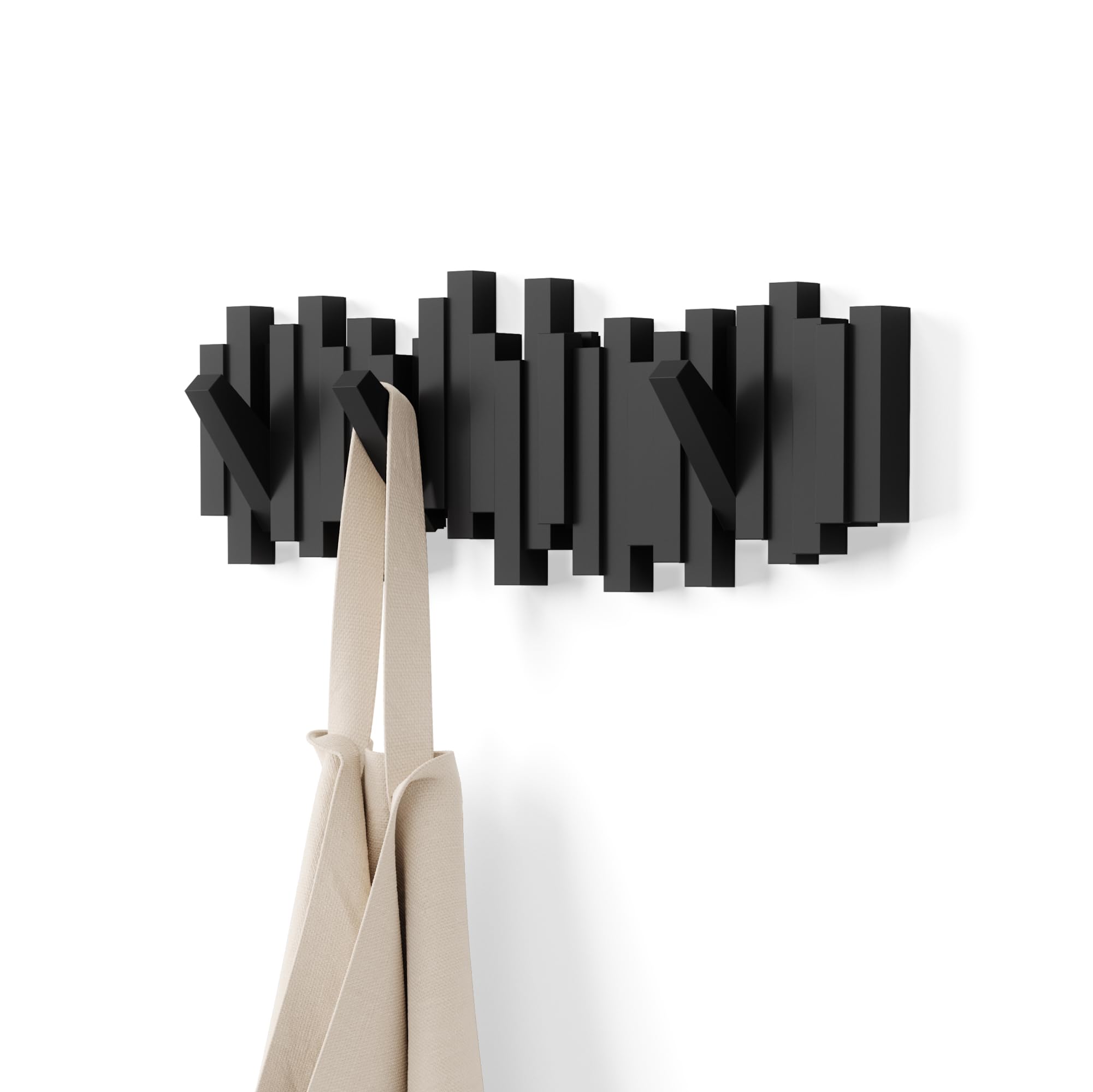 Umbra Sticks front view showing sculptural black wall rack and modern appeal