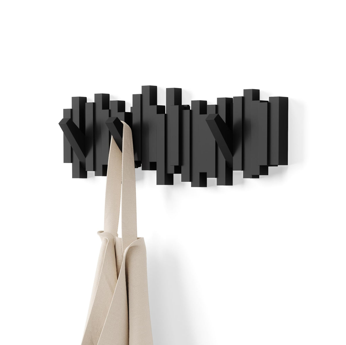 Umbra Sticks front view showing sculptural black wall rack and modern appeal
