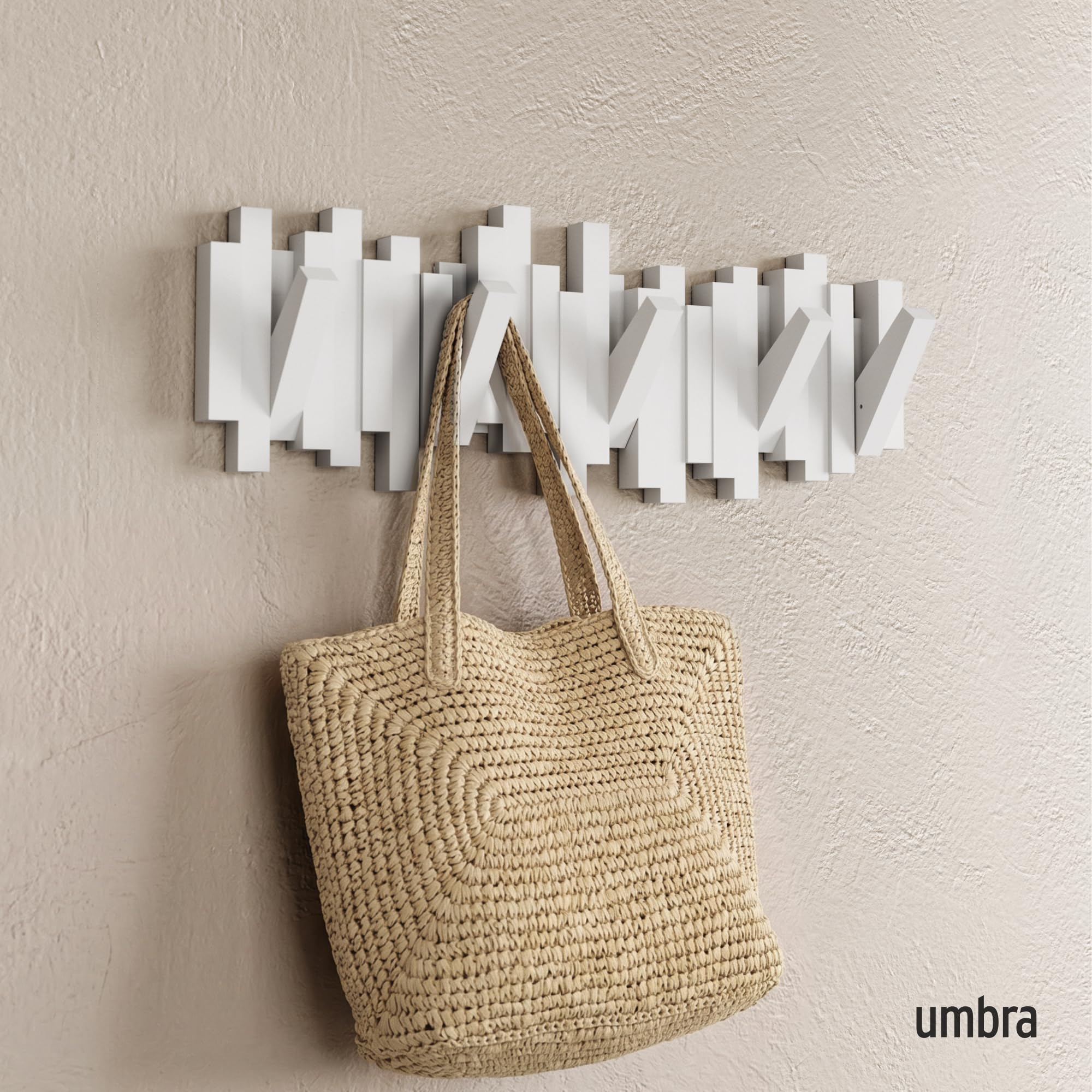 Umbra Sticks close-up of retractable hooks highlighting durable mechanism benefit