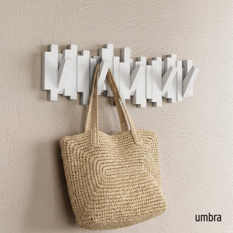 Umbra Sticks close-up of retractable hooks highlighting durable mechanism benefit
