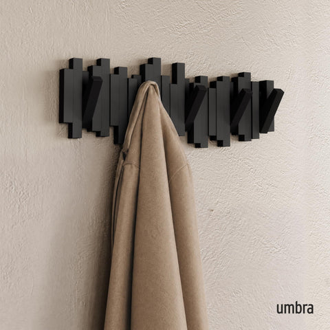 Umbra Sticks with five hooks down displaying organized coats and bags benefit