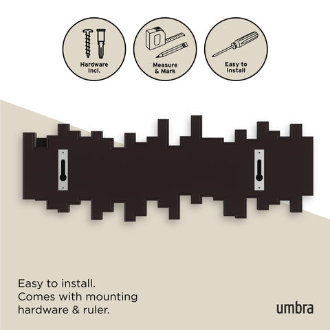Umbra Sticks installed in entryway organizing coats and keys efficiently