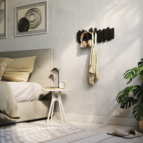 Umbra Sticks styled in a bedroom hanging robes and accessories neatly