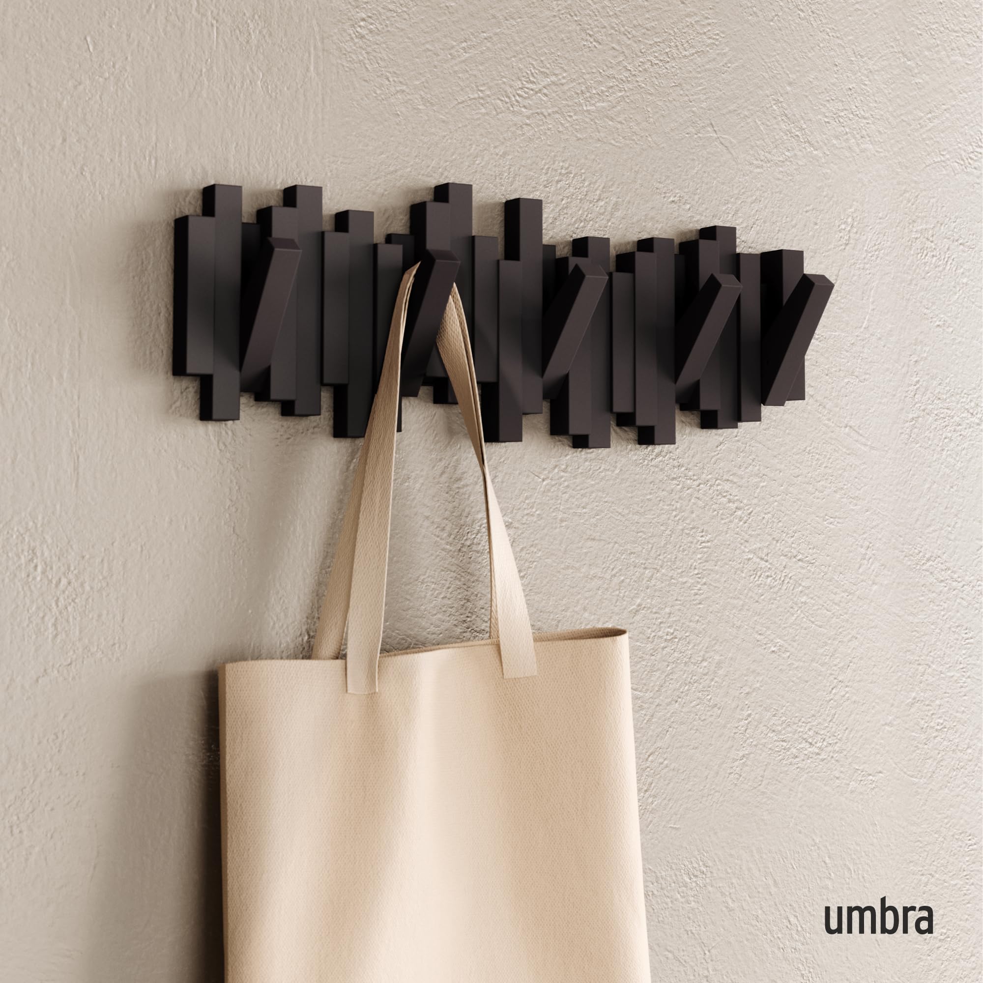 Umbra Sticks with pegs extended demonstrating handy hanging points