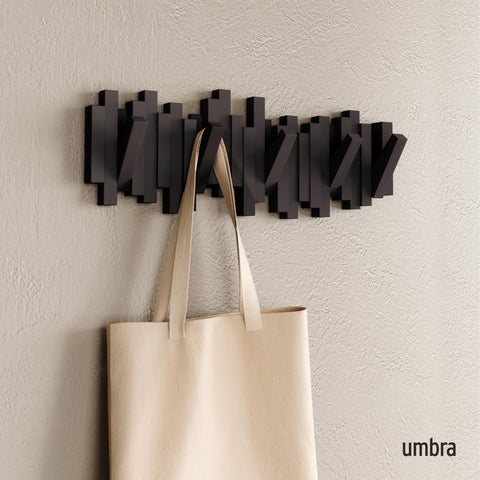 Umbra Sticks with pegs extended demonstrating handy hanging points